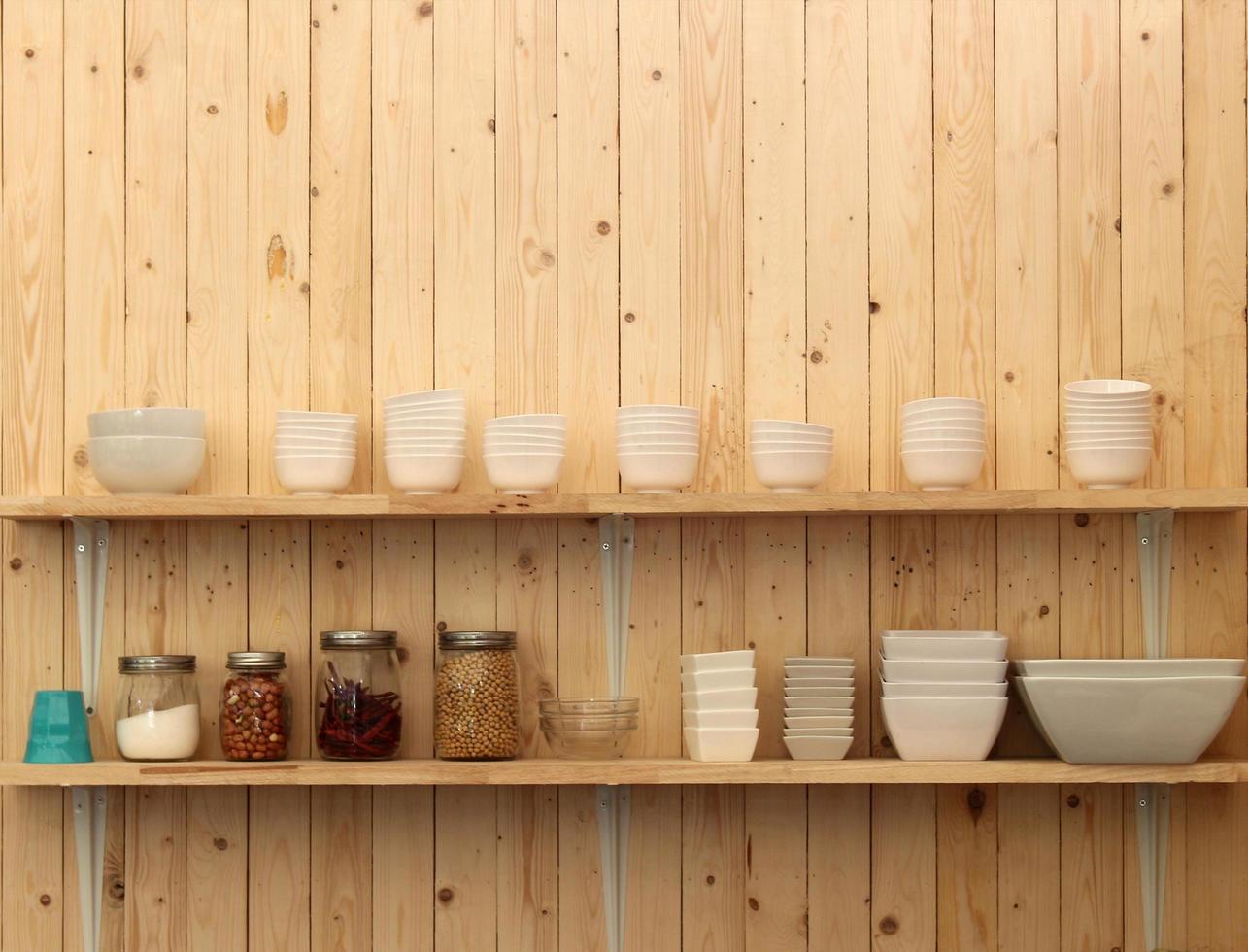 Kitchenware on shelves photo