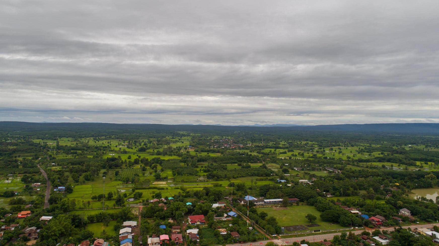 Aerial view over small village near the country roadside photo