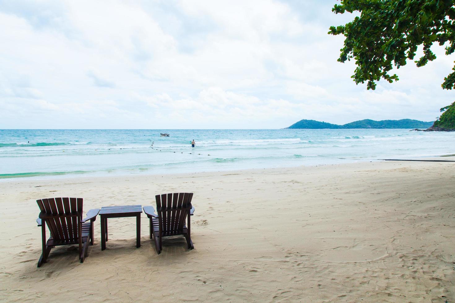 Chairs and table on the beach photo