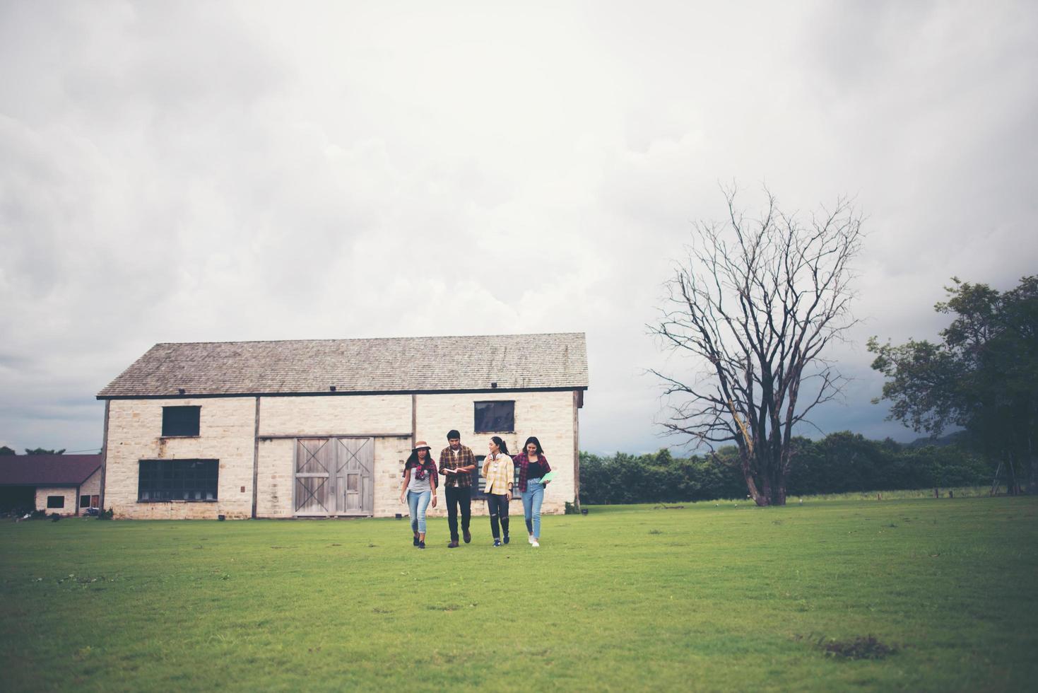 Group of students walking through the park after class photo