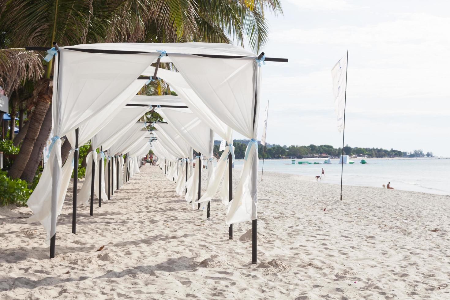 White tents on the beach in Thailand photo