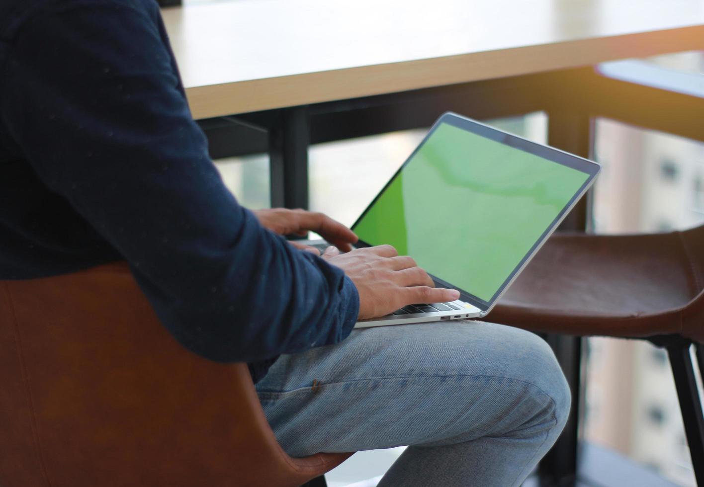 Person with laptop in lap mock-up photo