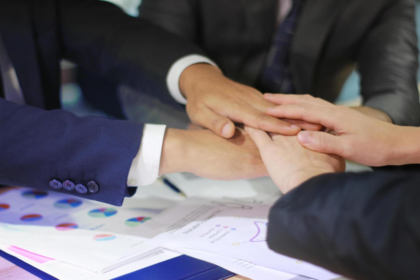 Business professionals joining hands photo