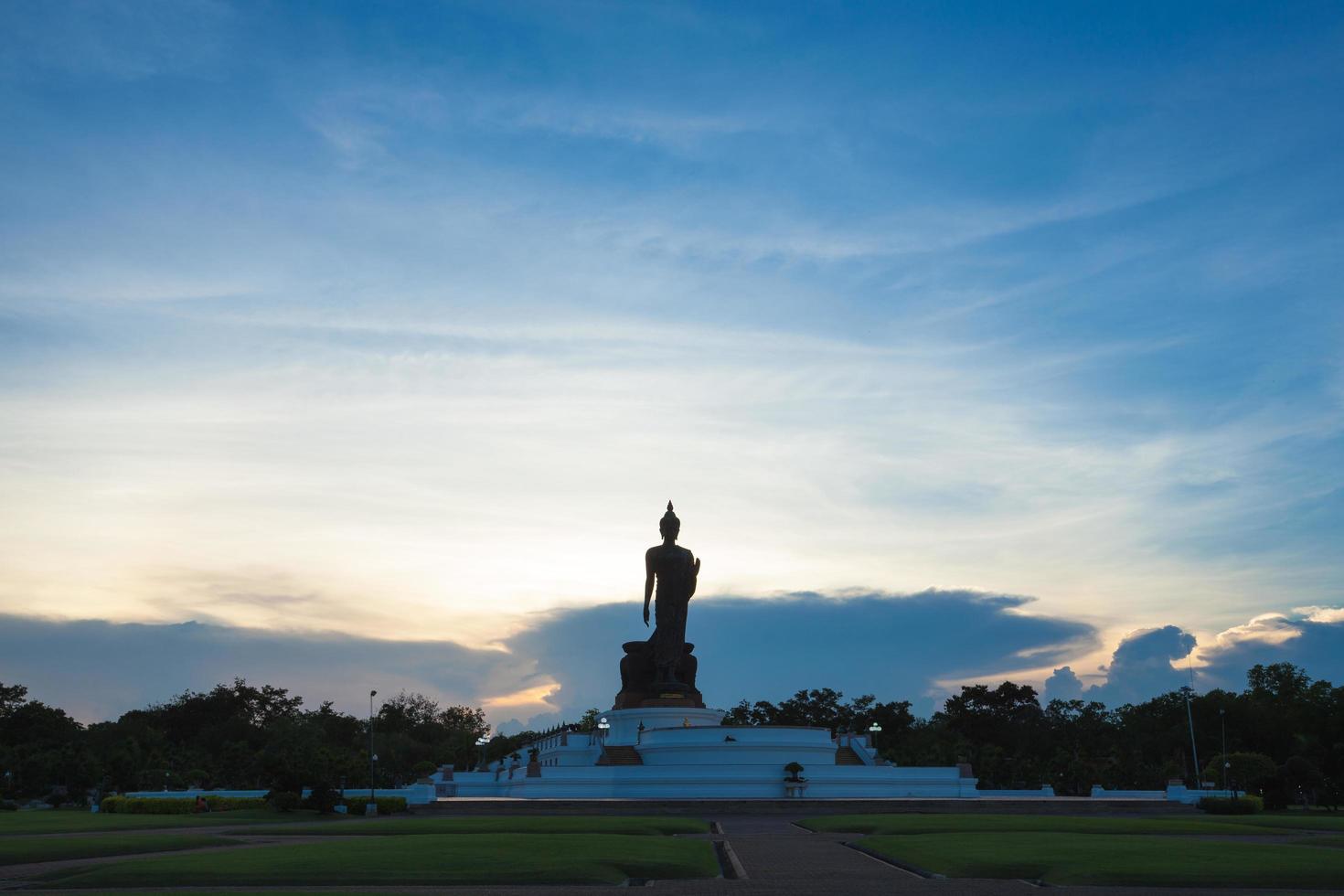 Silhouette of a large Buddha statue in Thailand photo