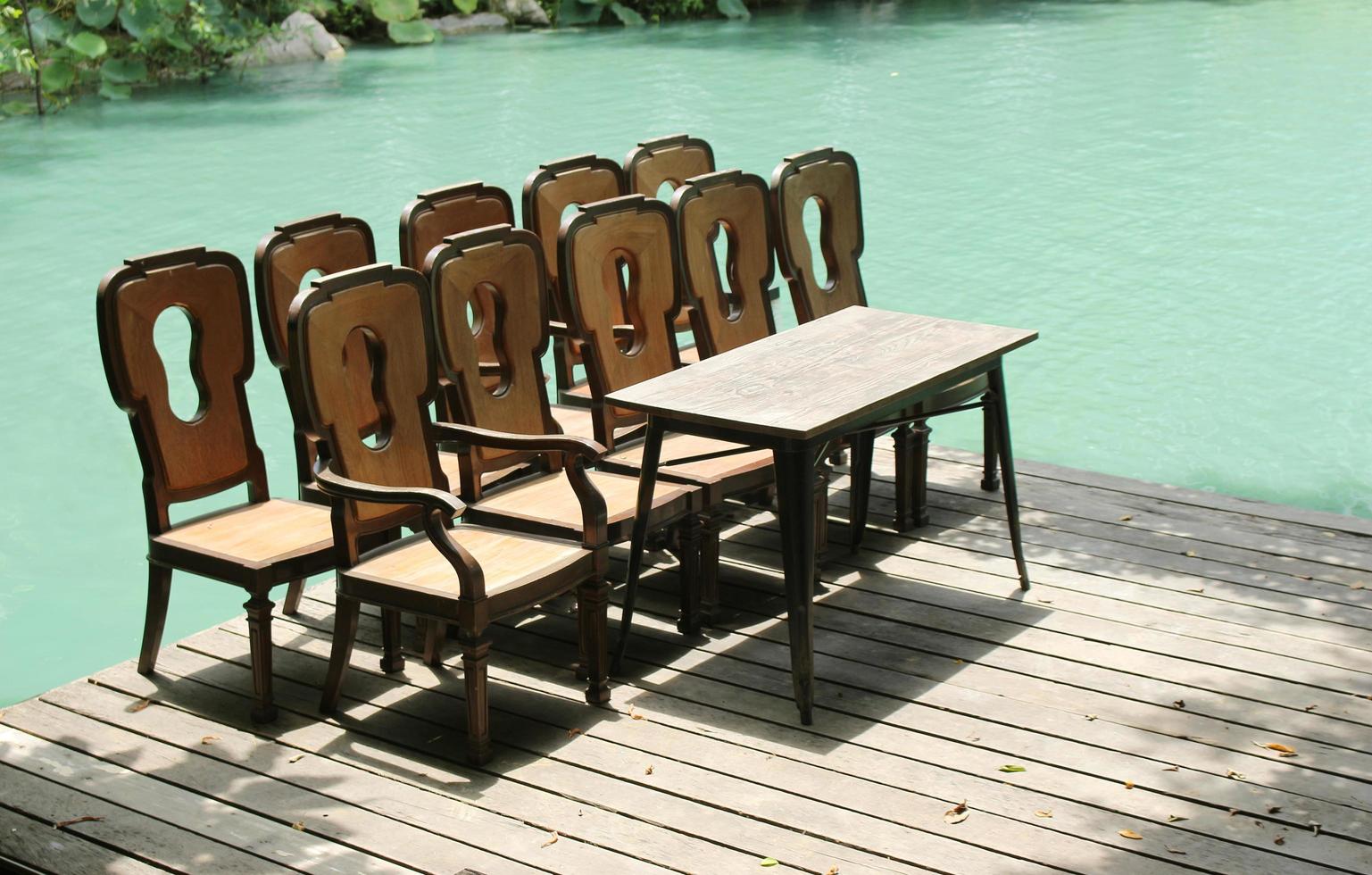 Chairs and table on dock photo