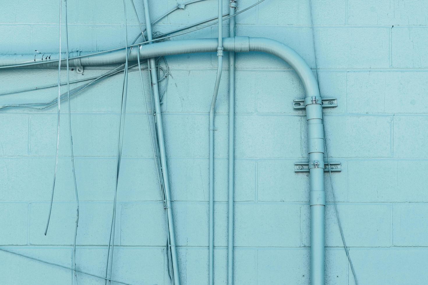 Blue wall with pipe system photo