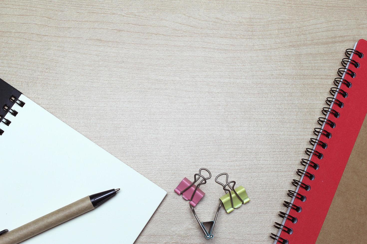 Desk with notebook and clips photo