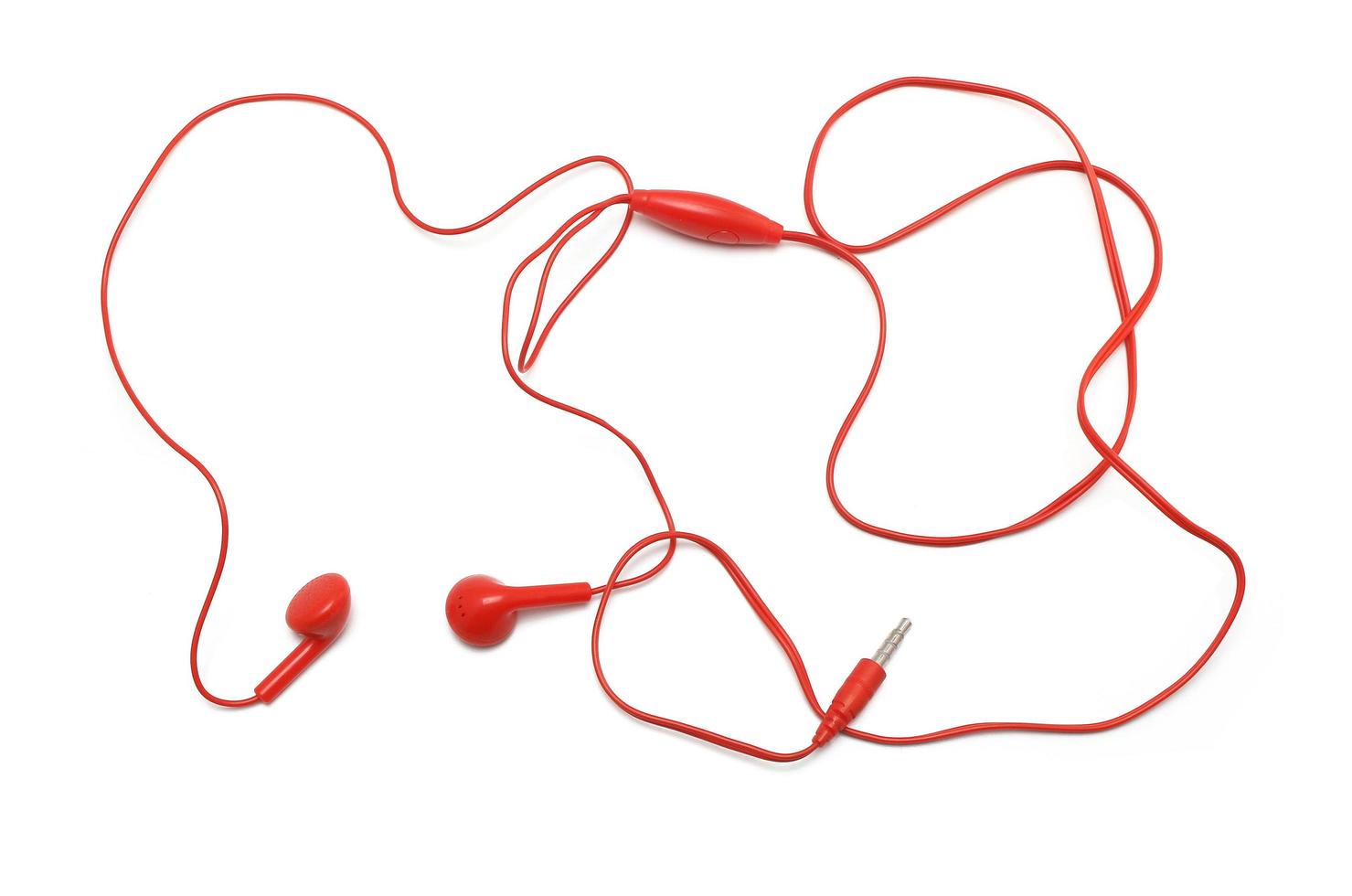 Red earphones on white background photo