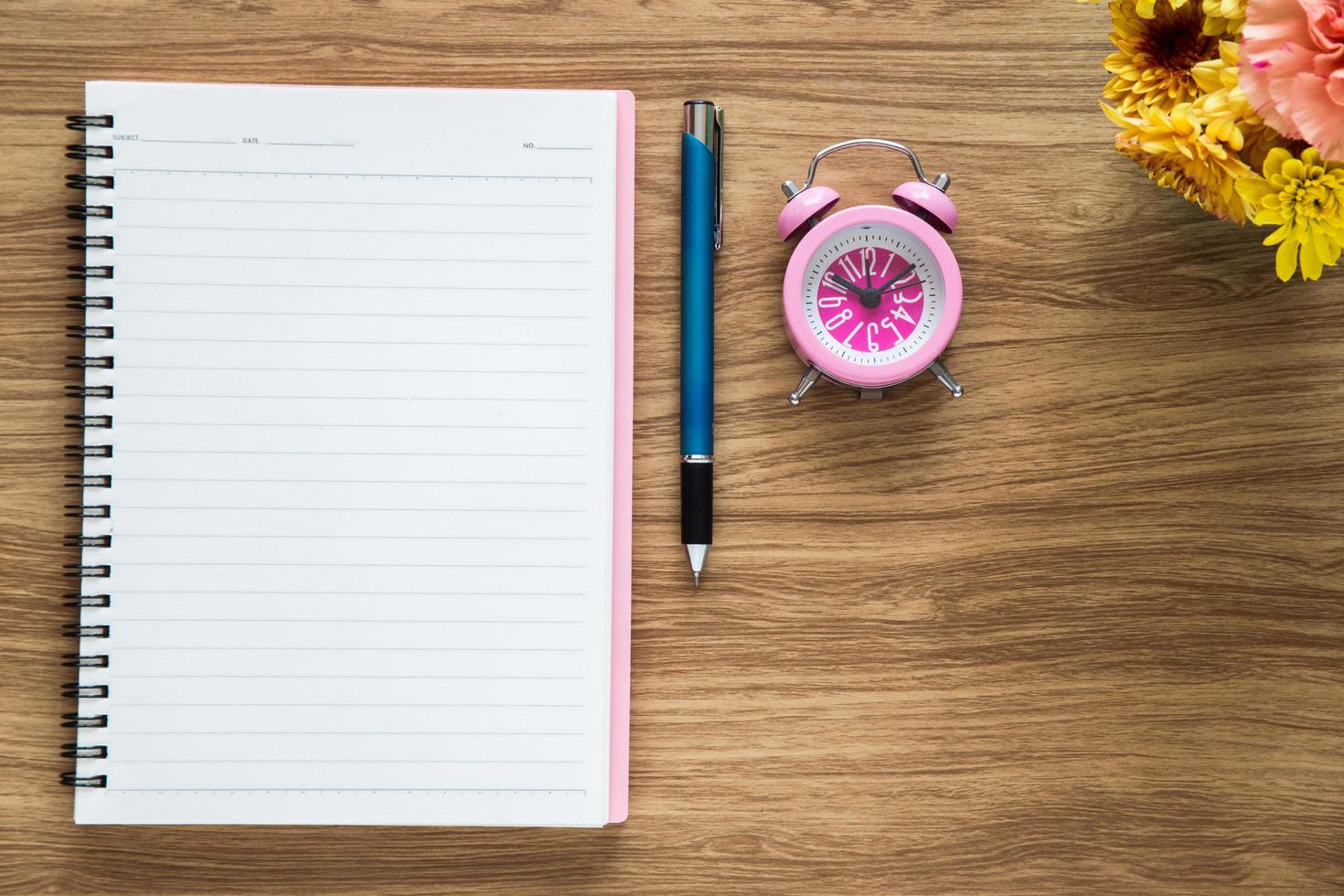 Top view of blank paper notebook on workspace photo