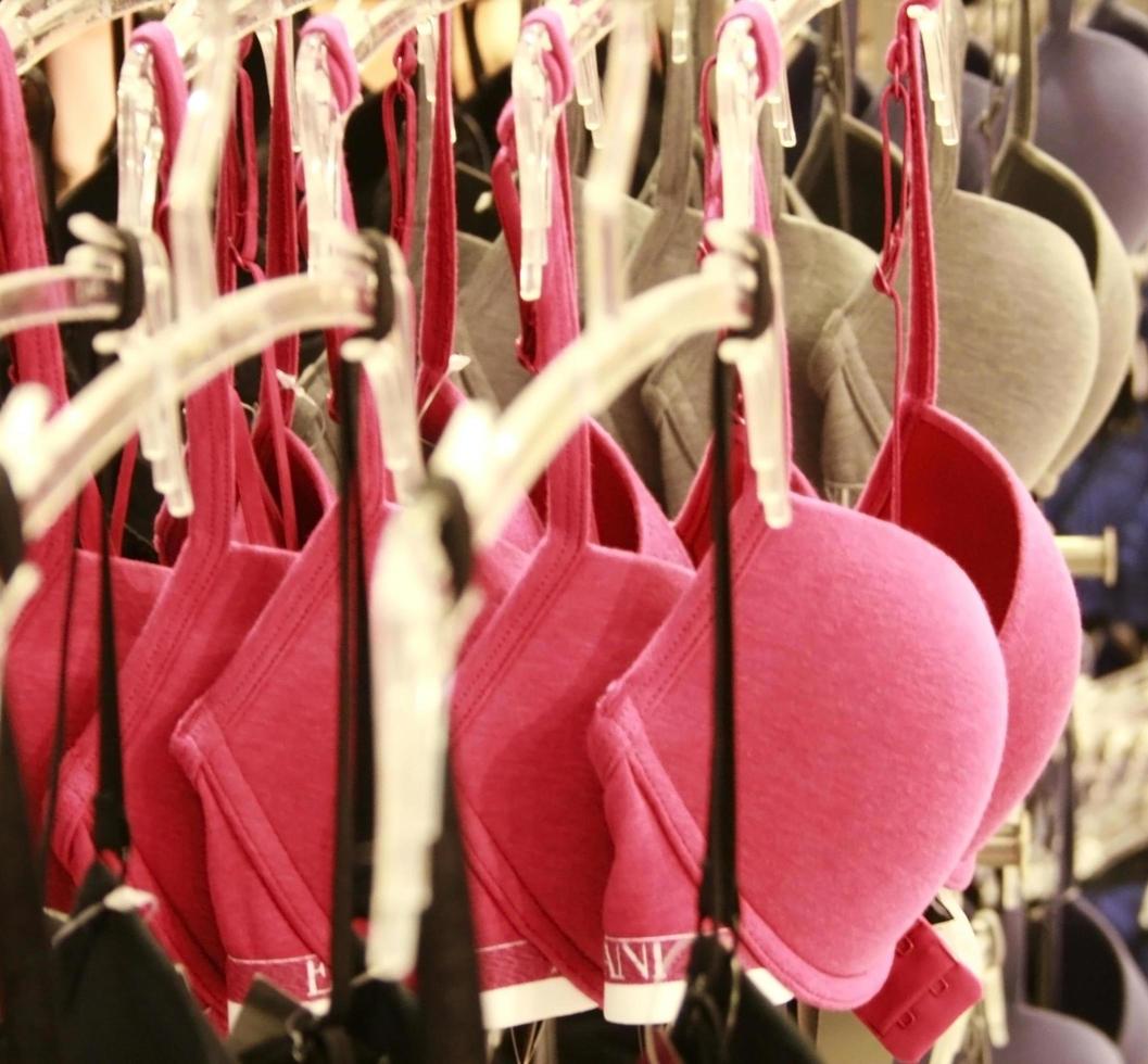 Row of bras hanging in store photo