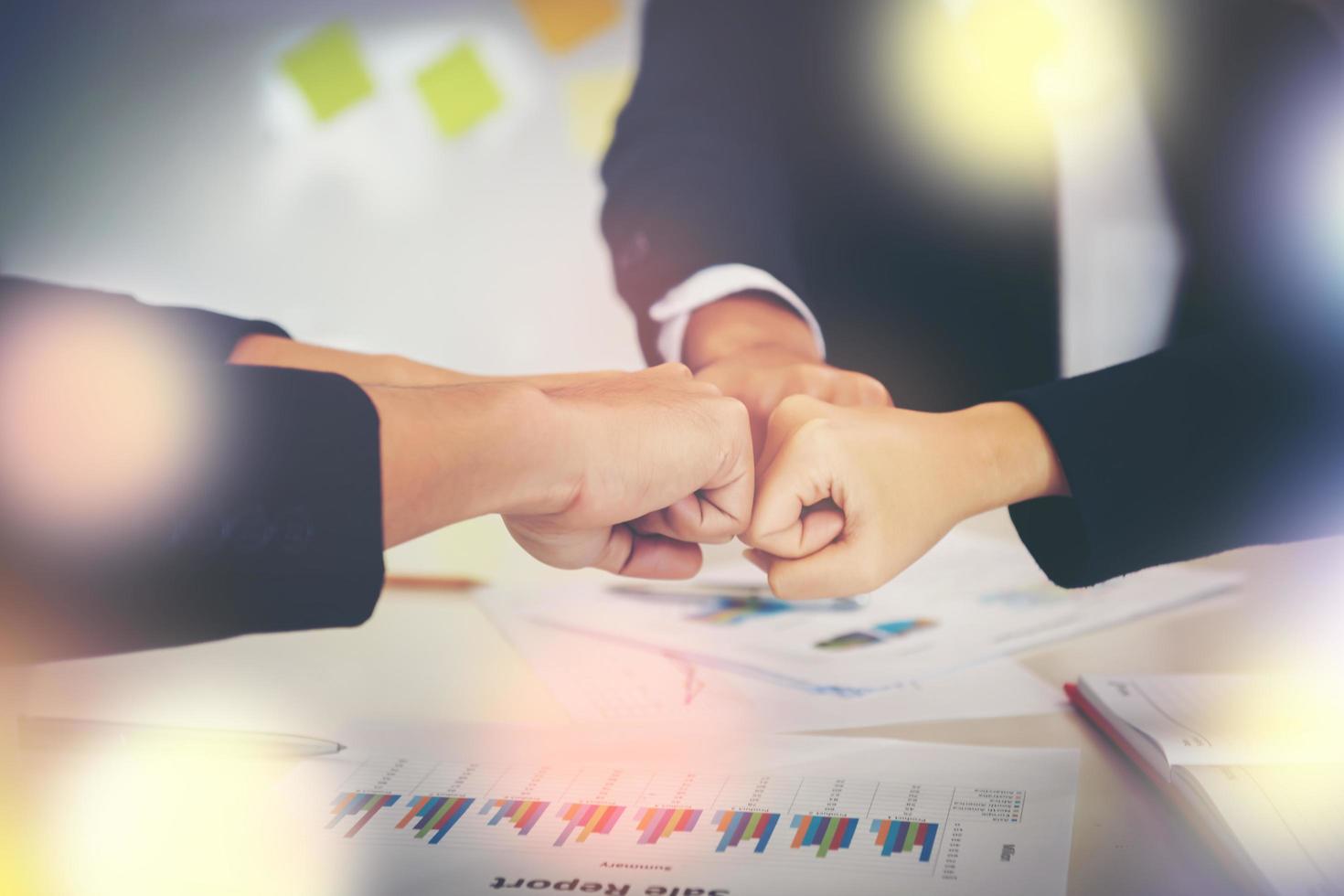 Business people showing fist bump after meeting partnership photo