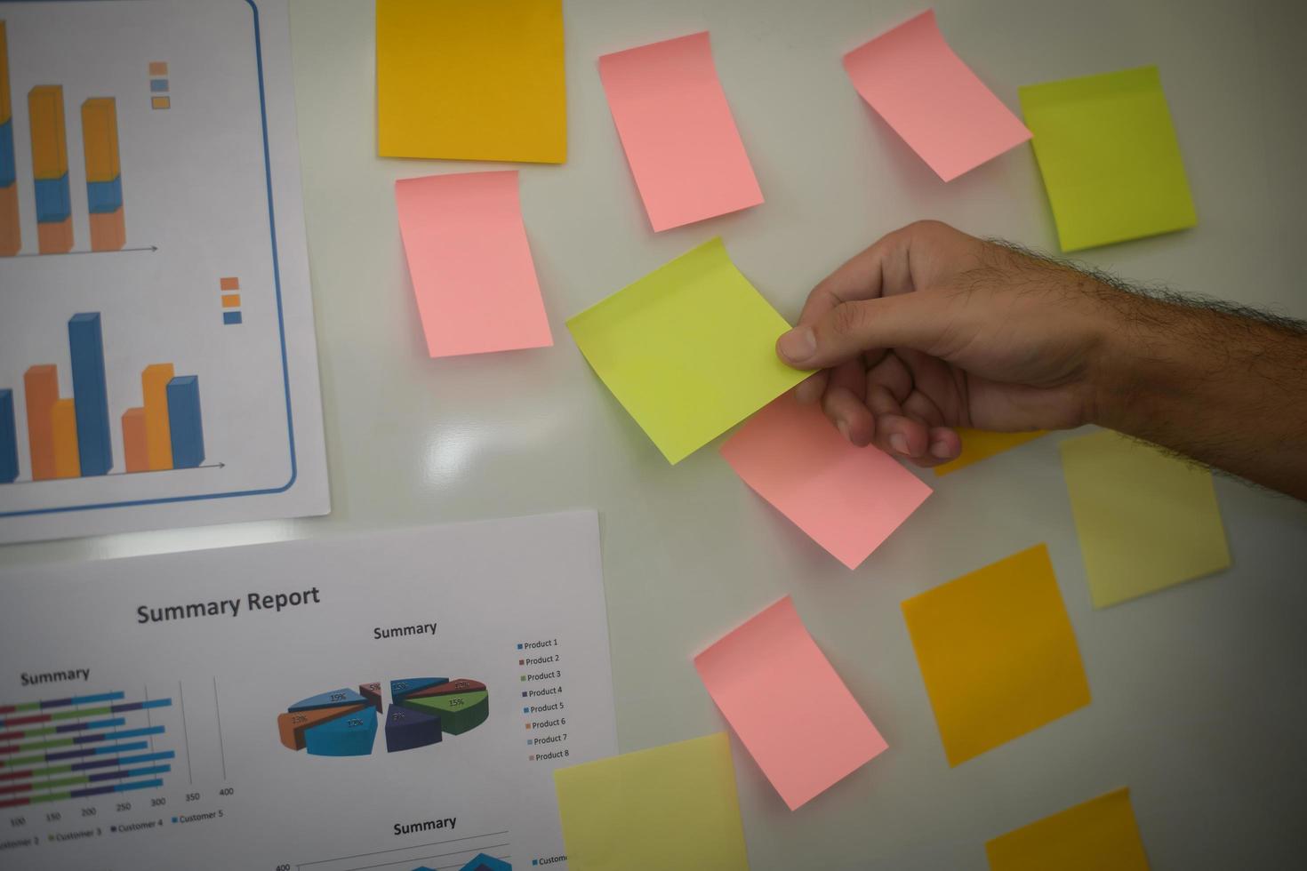 Close-up of hand presenting business chart on whiteboard photo