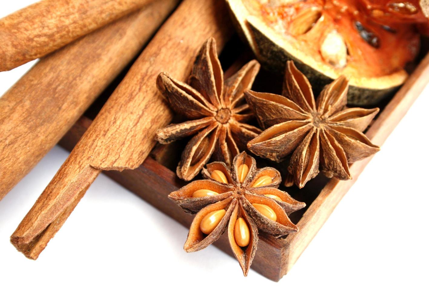 Cinnamon sticks, anise stars and dried quince photo