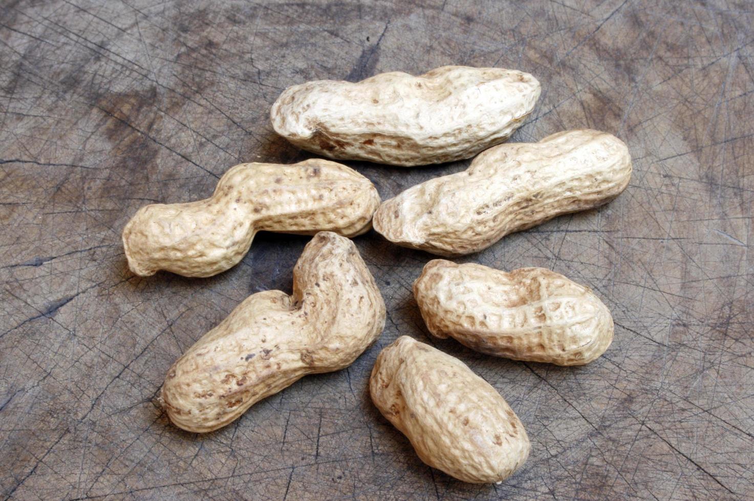 Peanut shells on wood photo