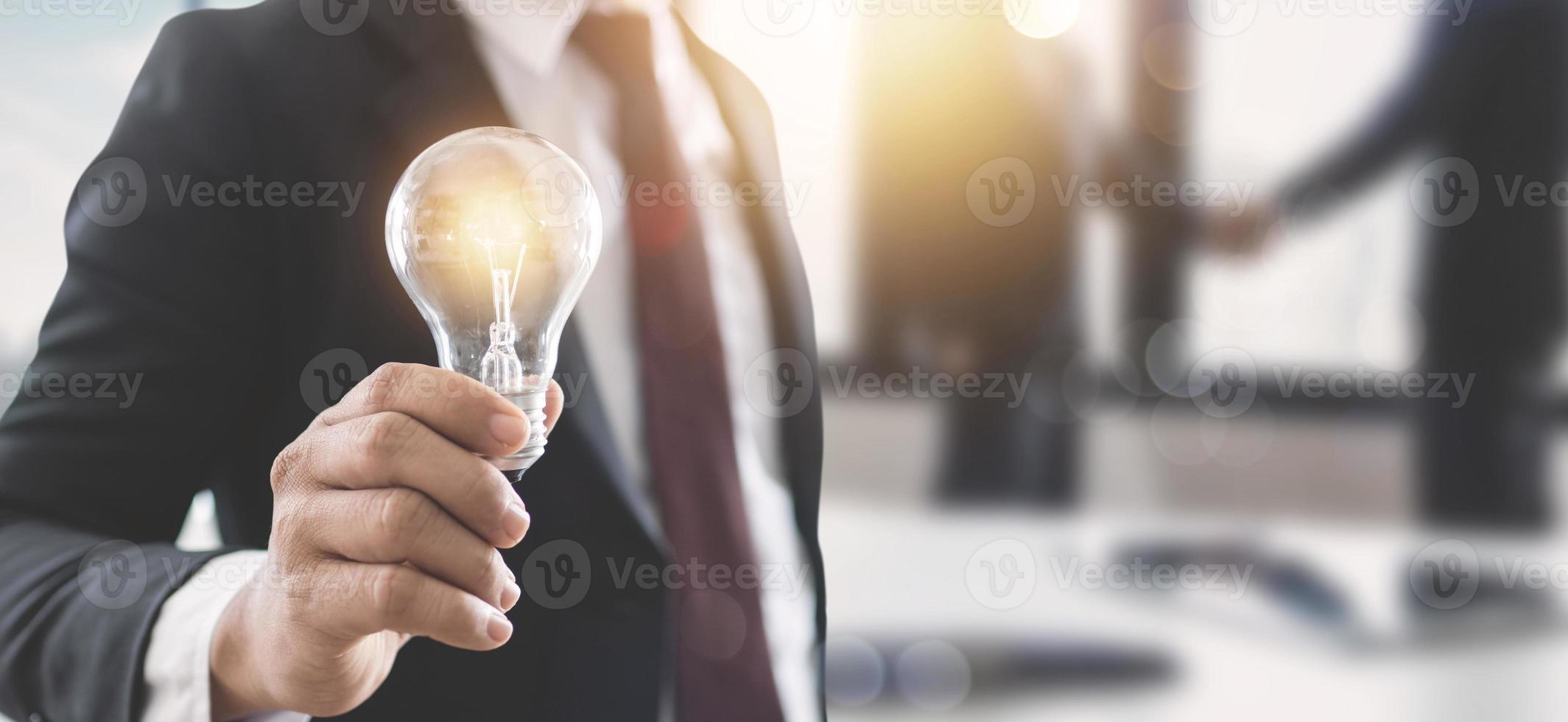 Person holding a light bulb photo