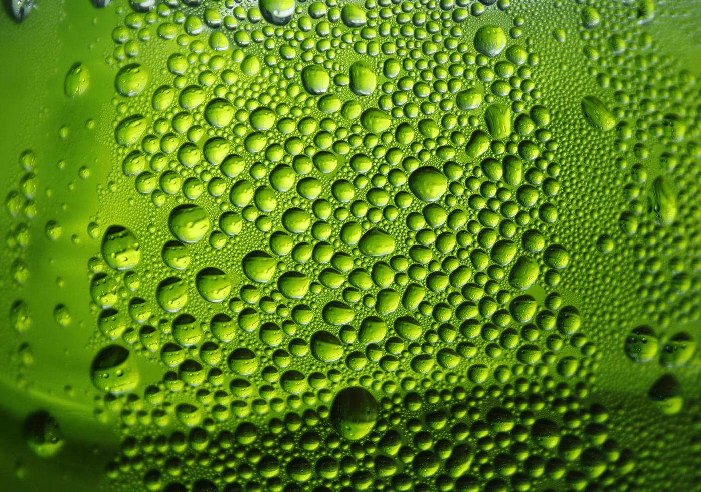 Water on green background photo