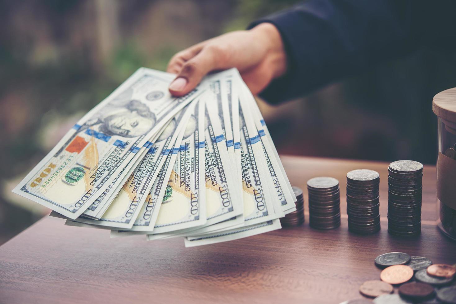 Hands of businesswoman holding money photo