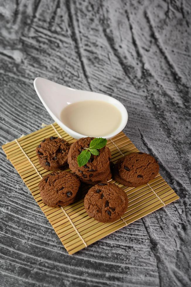 Cookies and a spoon of milk photo