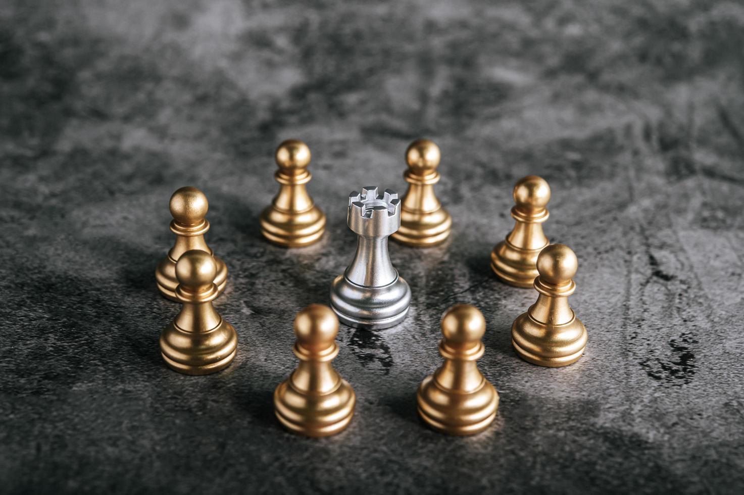 Gold and silver chess board pieces photo