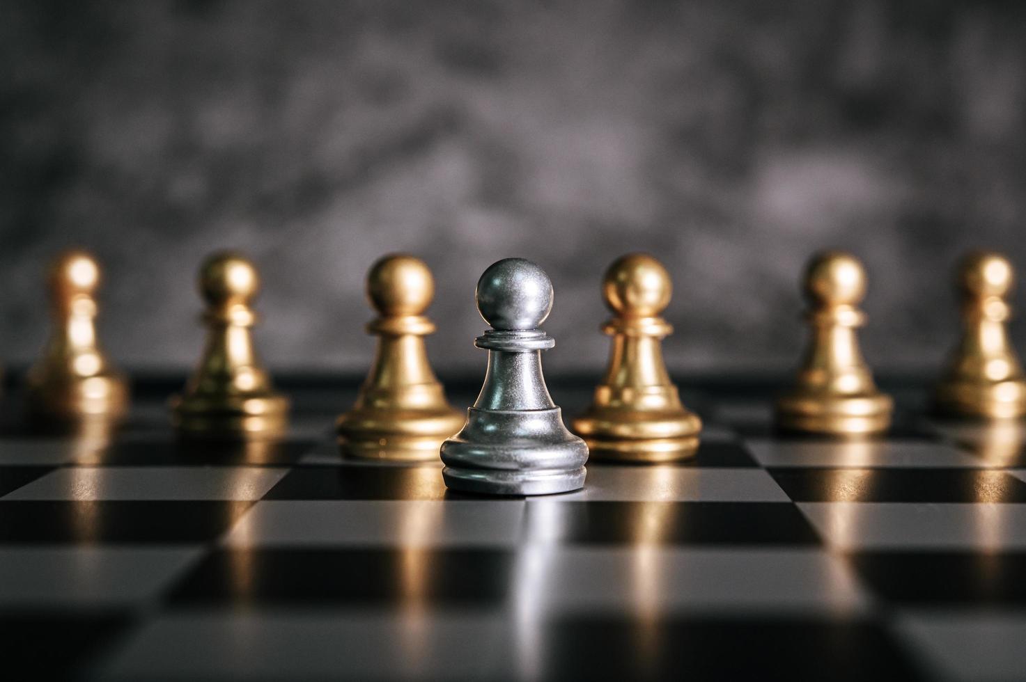 Gold and silver chess board pieces photo