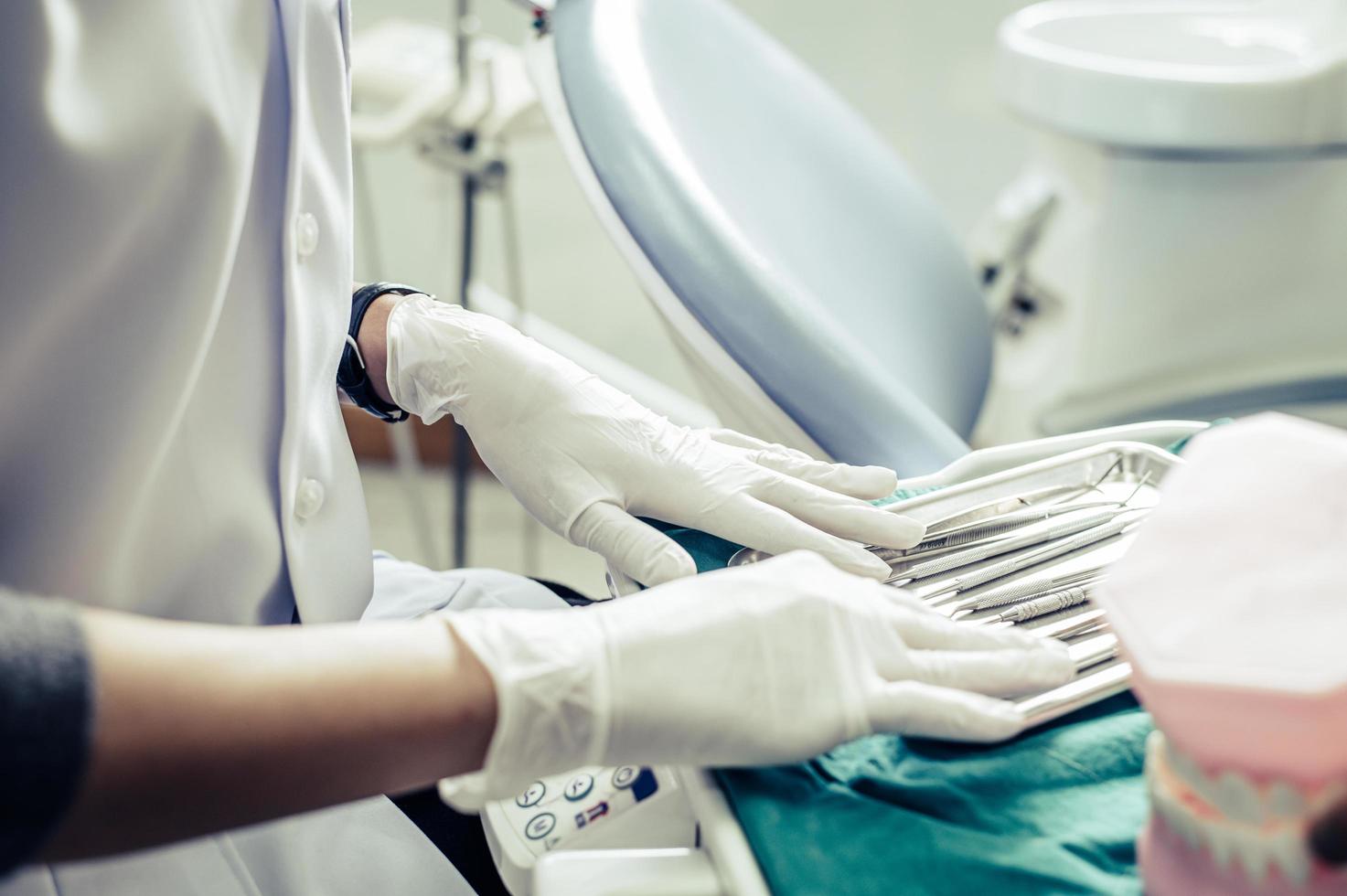 Dentists chooses equipment on the table photo