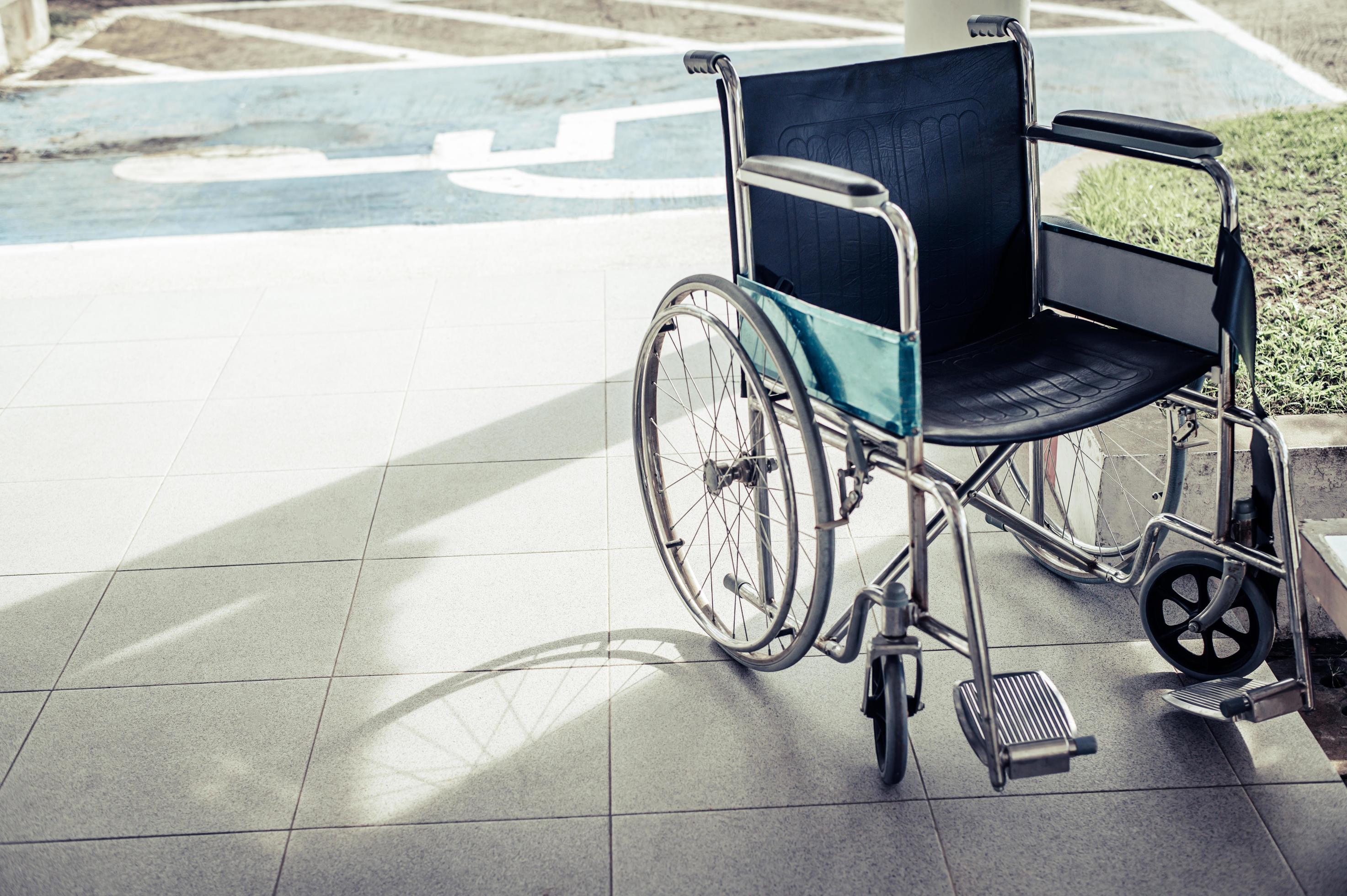 Patient wheelchair parked in front of the hospital 1978008 Stock Photo