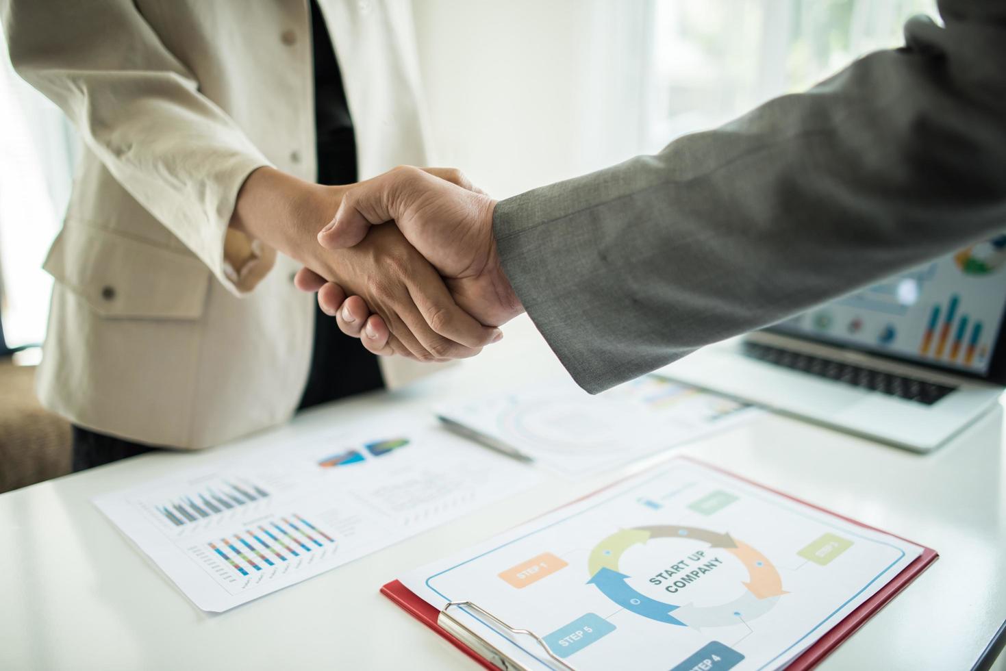 Businessmen shaking hands photo