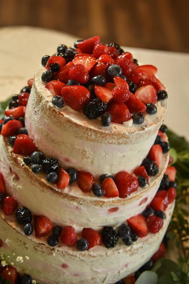 Strawberries with blueberries on a cake photo