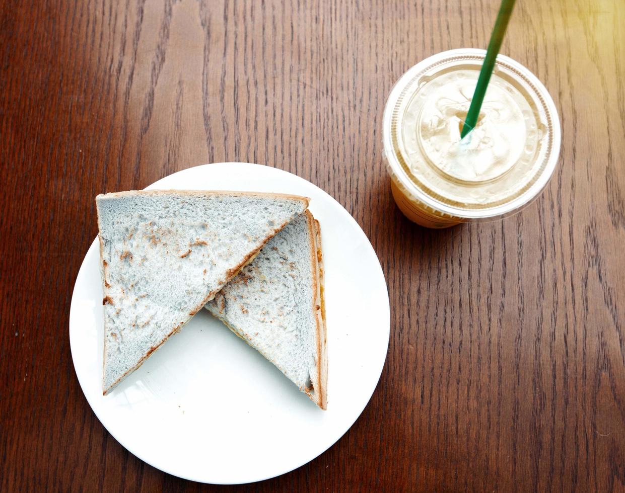 Top view and close up of breakfast bread and ice coffee photo