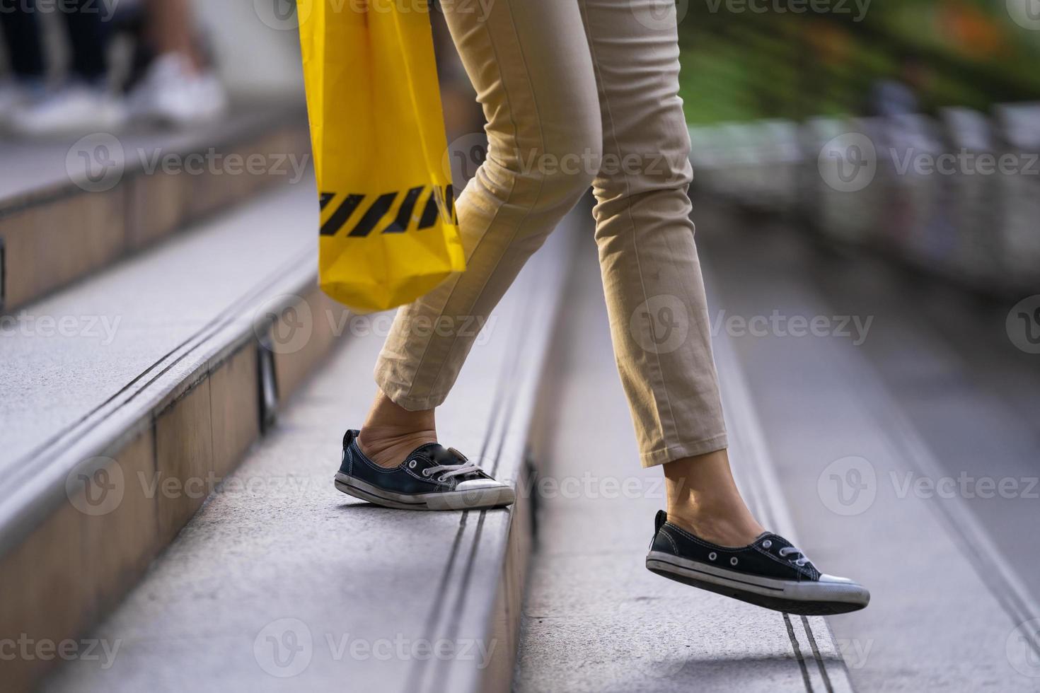 Close-up of person walking on stairs photo