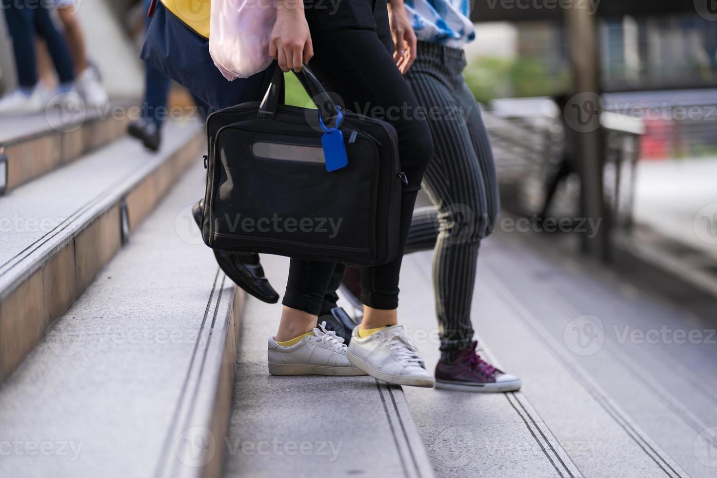 People commuting in a city photo