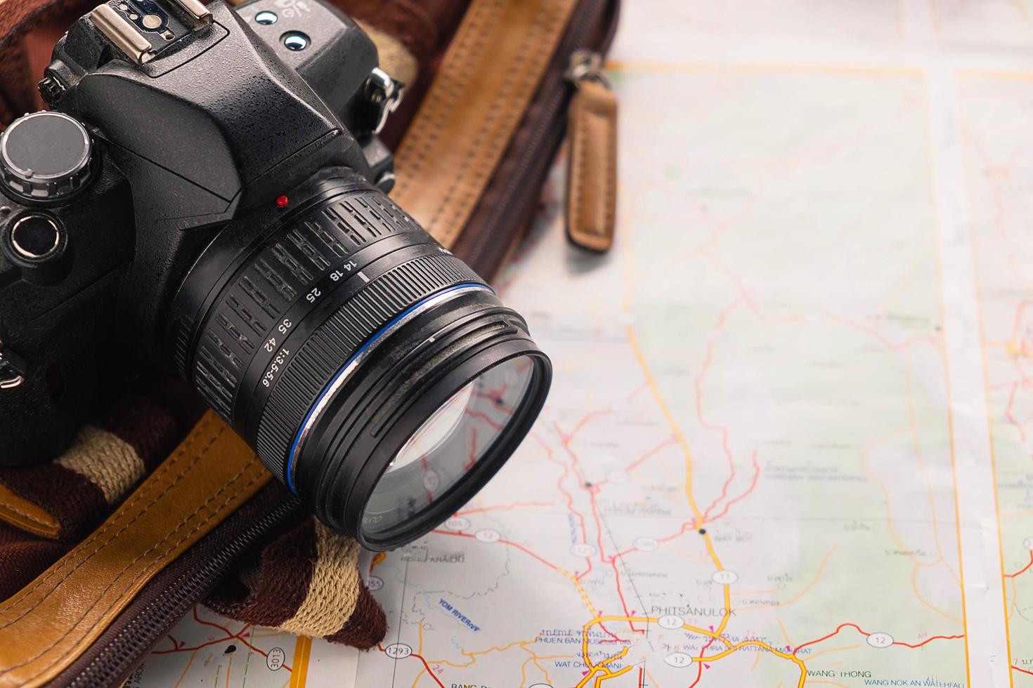 Camera and bag on a map photo