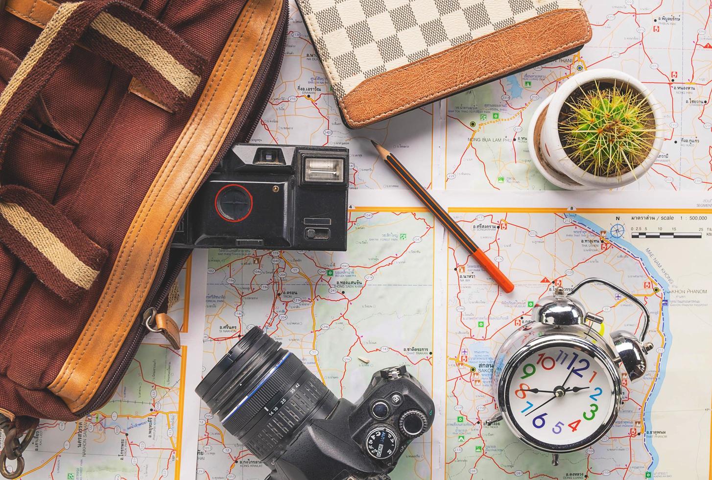 Travel planning items on a map photo