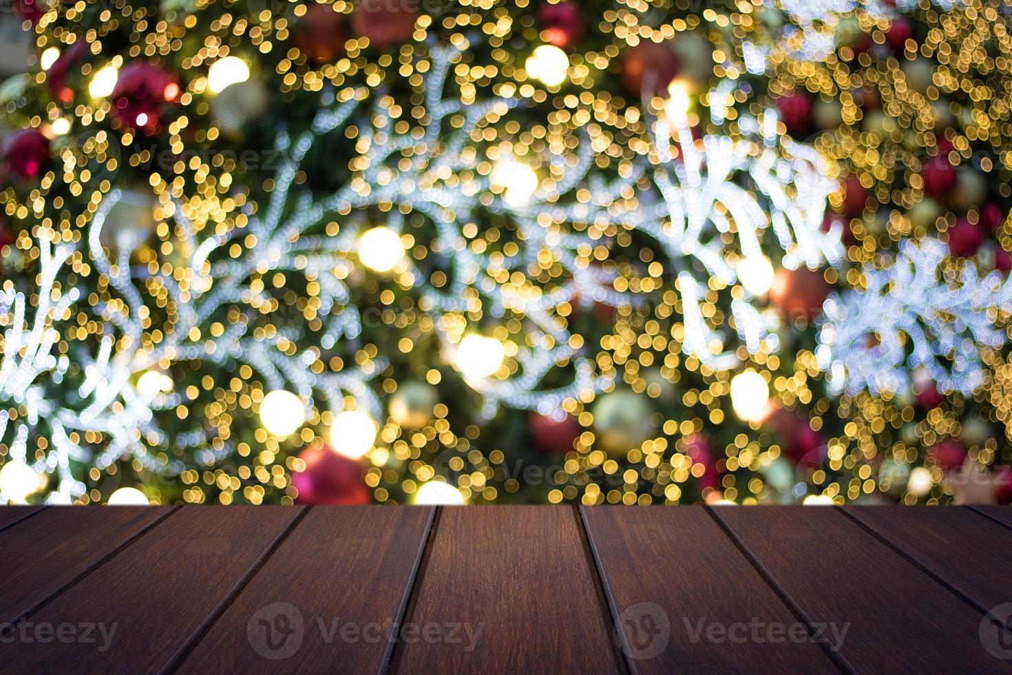 Wood table on soft blur Christmas background photo