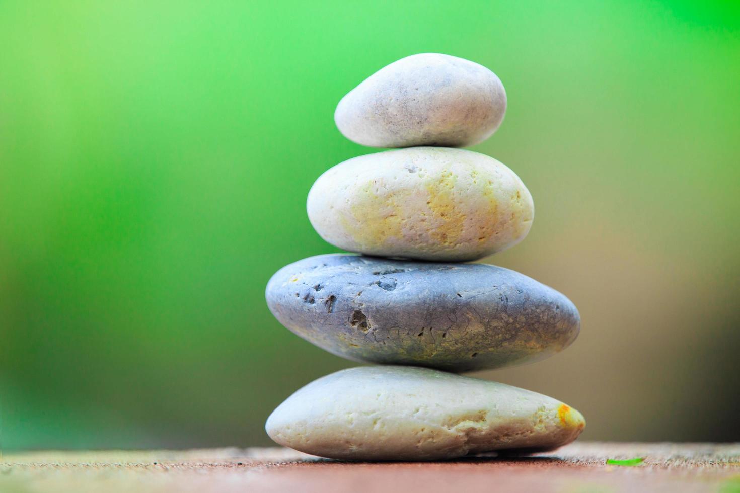 Zen Stone On A Green Background Stock Photo