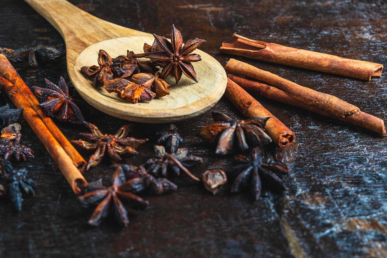 Anise and cinnamon with a wooden spoon photo