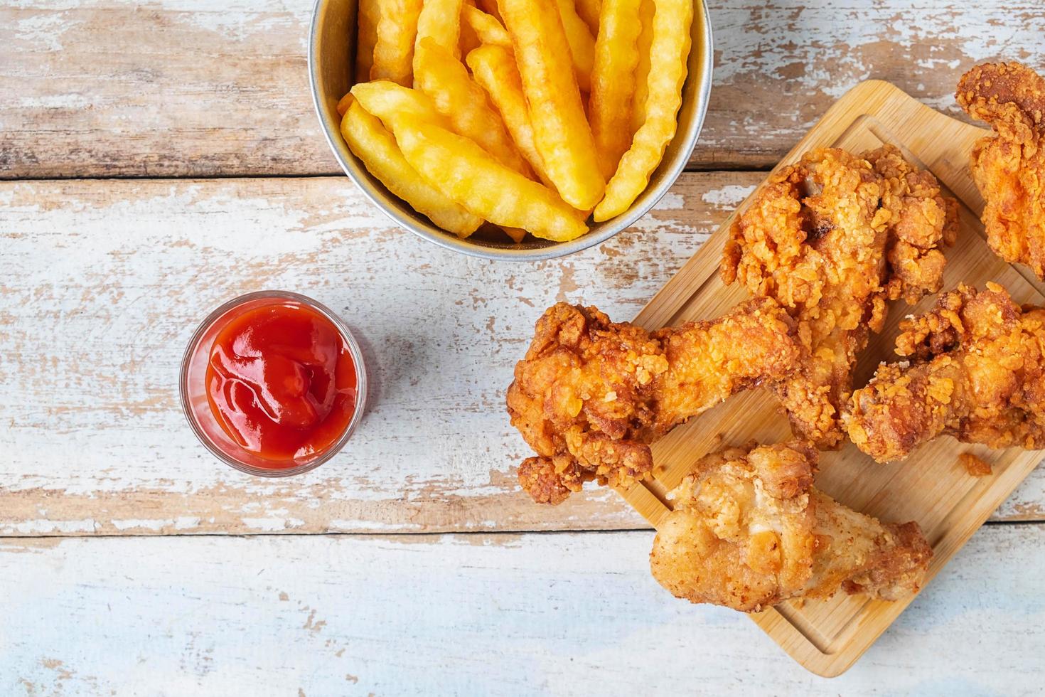 Top view of fried chicken and fries photo