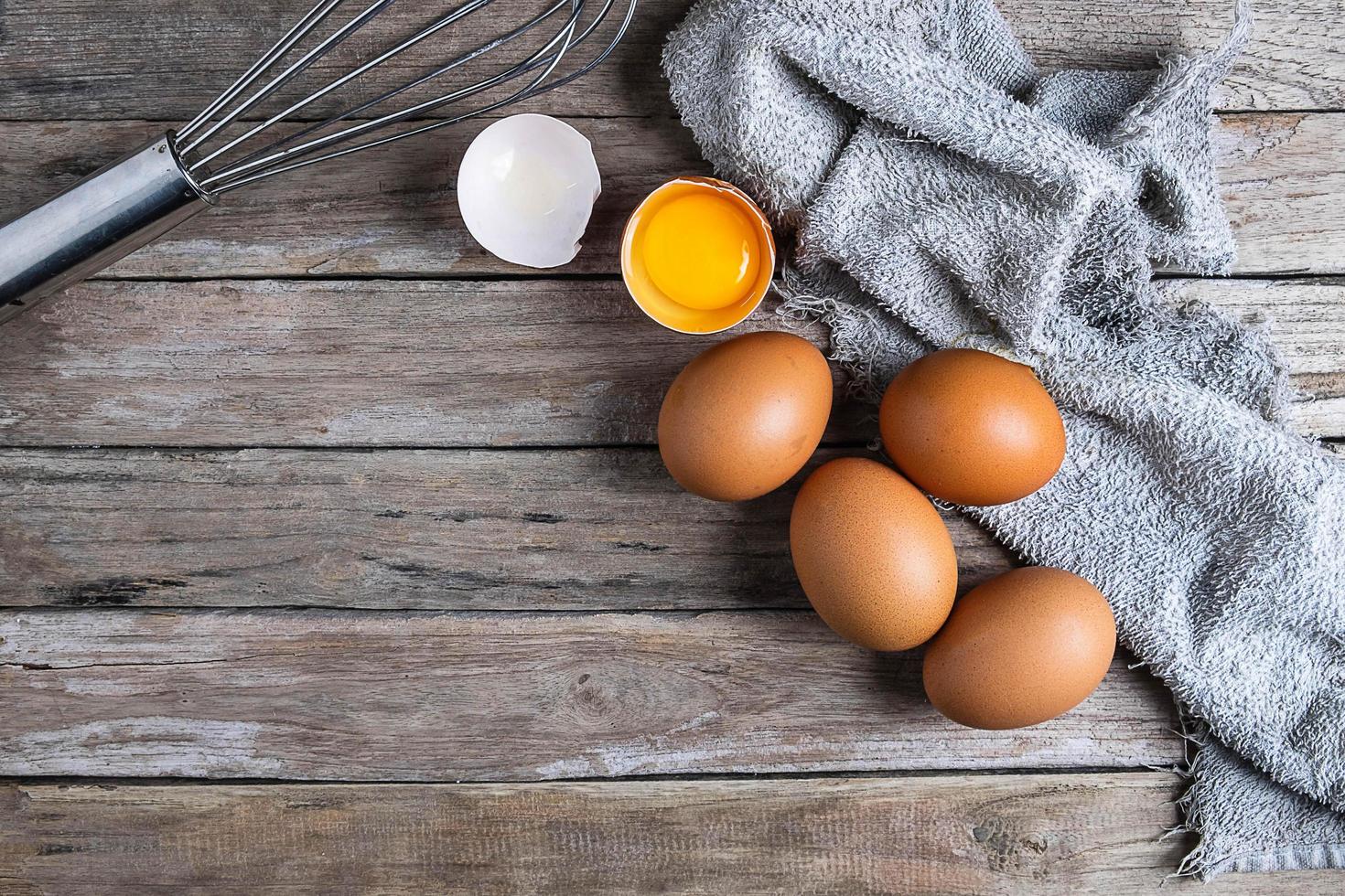 Fresh eggs on a wooden table photo