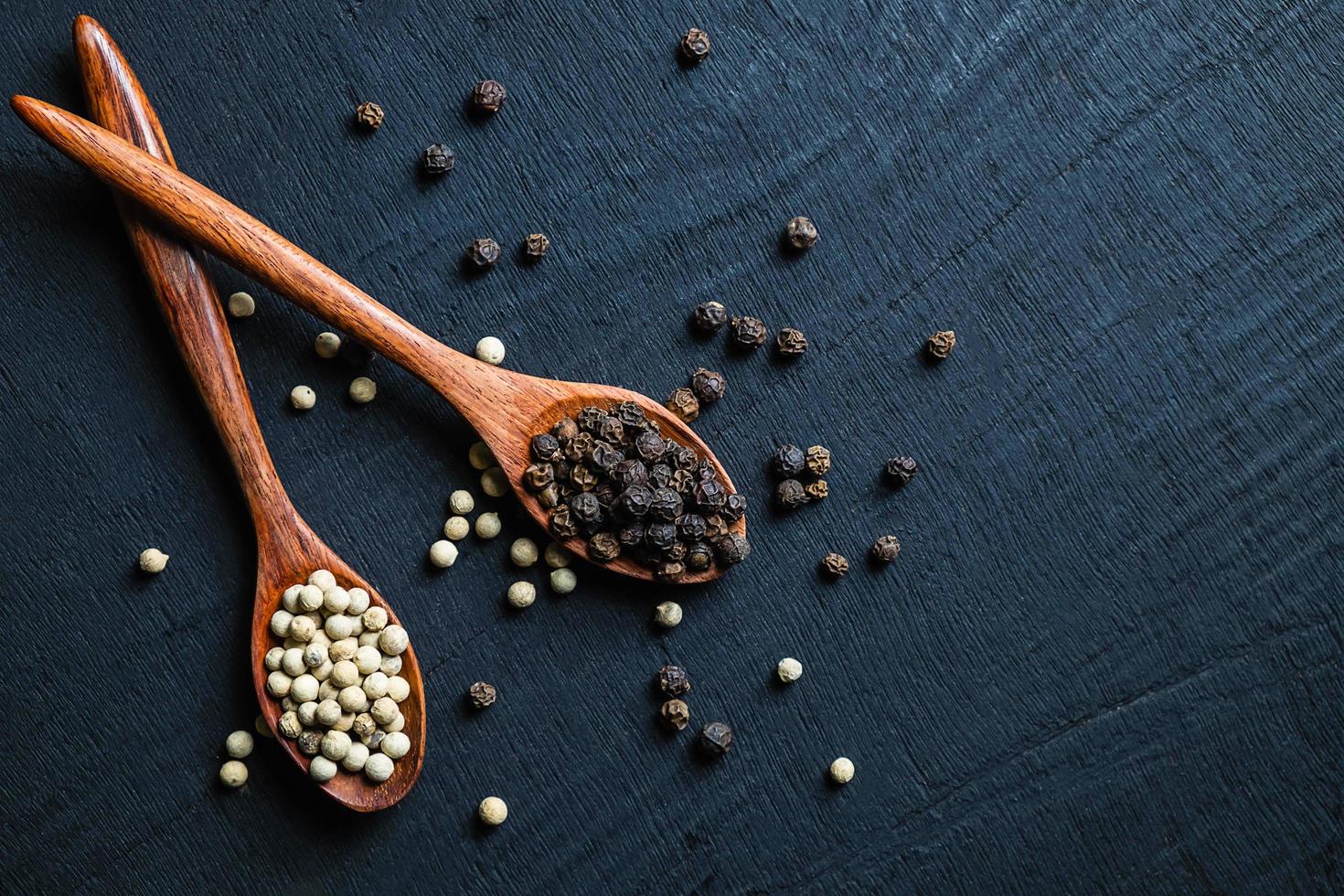 Top view of pepper and spoons photo