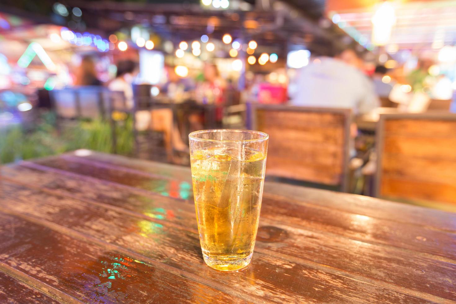 A glass of beer on the table photo