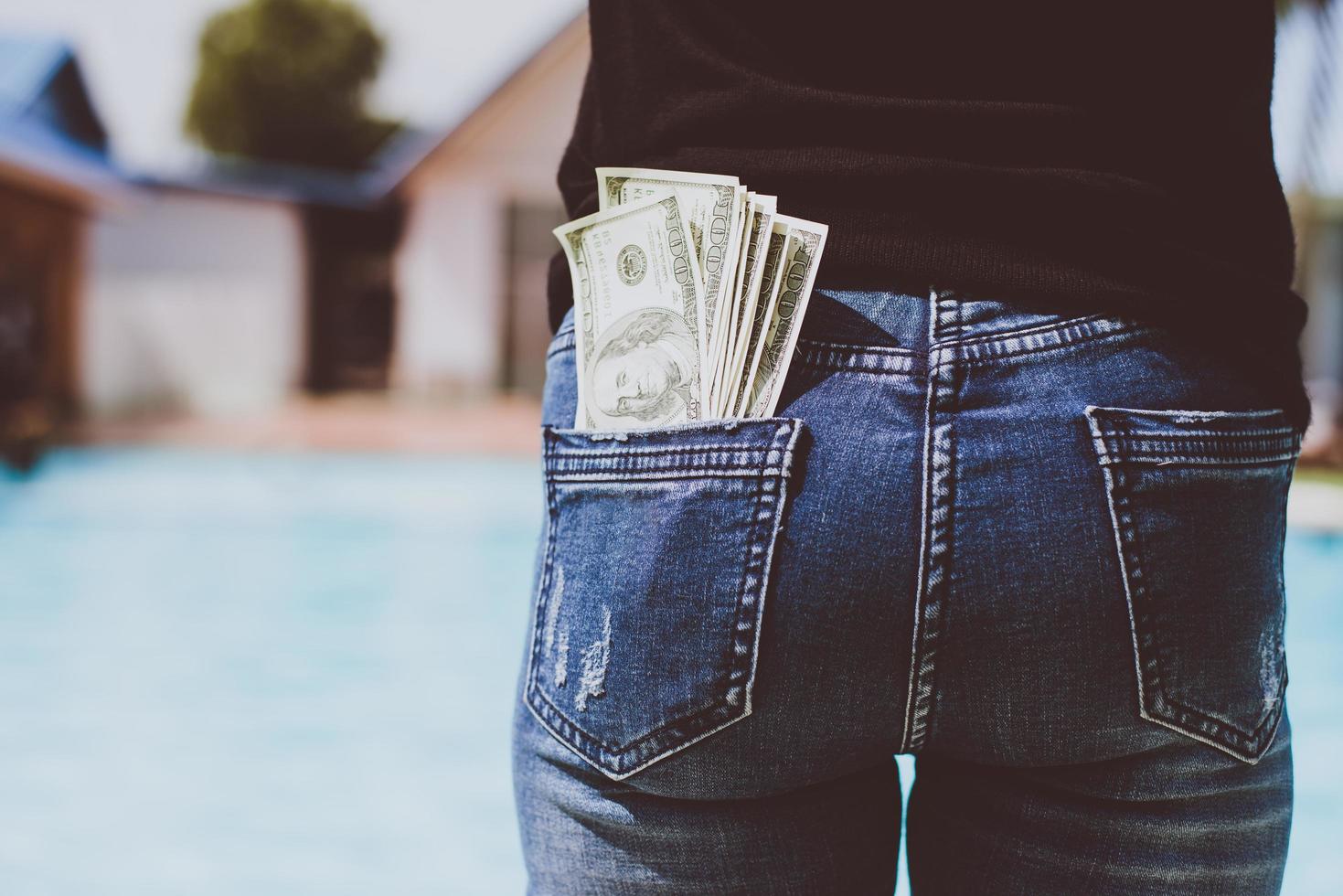 Woman with money in her back pocket photo