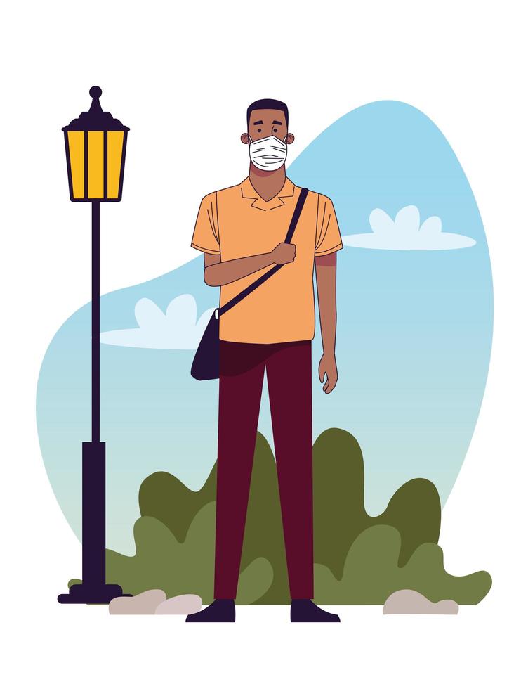 young black man wearing medical mask in the park vector