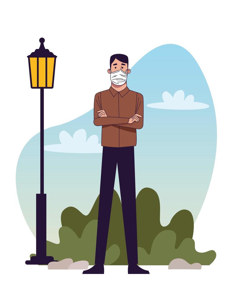 young man wearing medical mask in the park vector