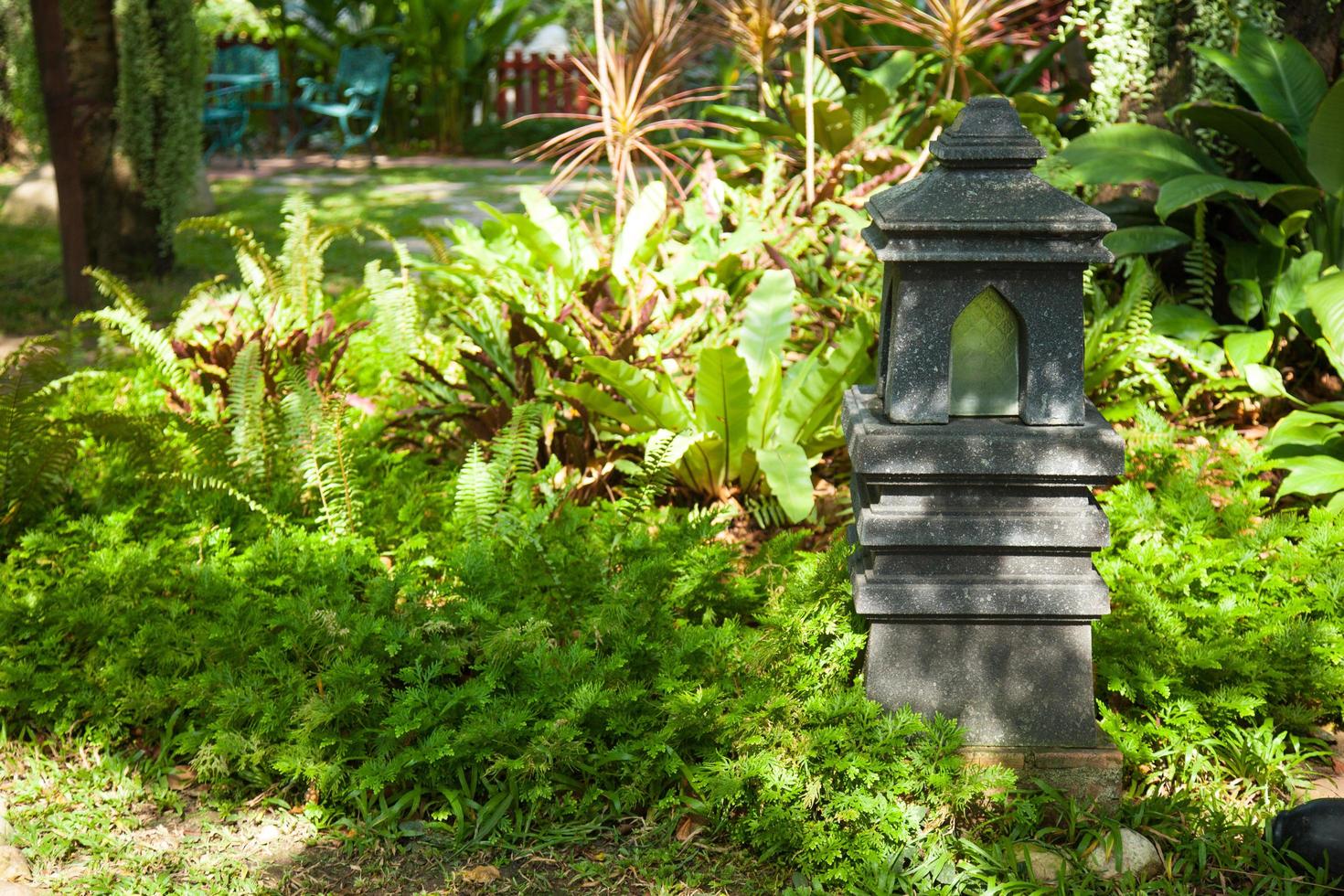 Decorated stone lantern in the garden photo