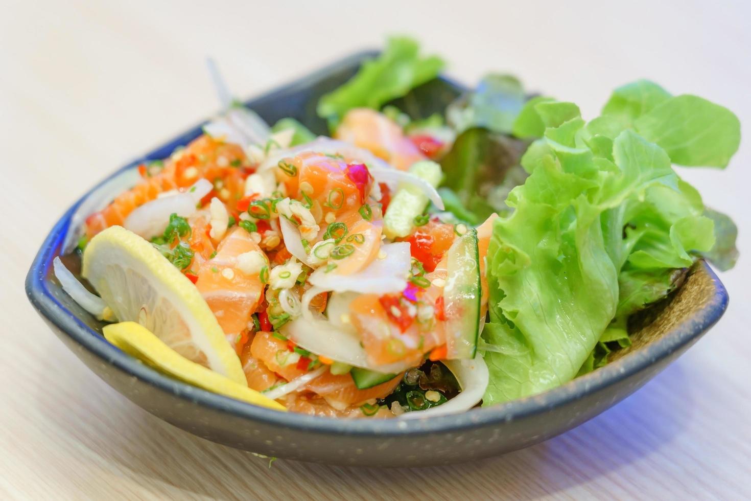 Salmon sashimi in spicy hot sauce photo