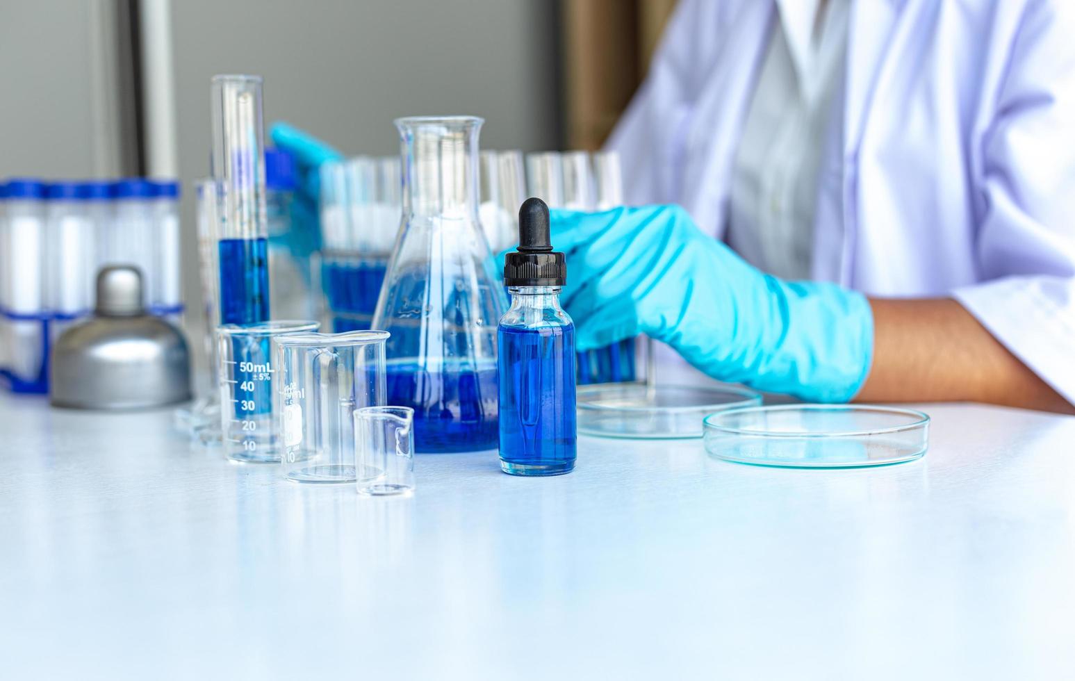 Scientist's laboratory with beakers and droppers photo