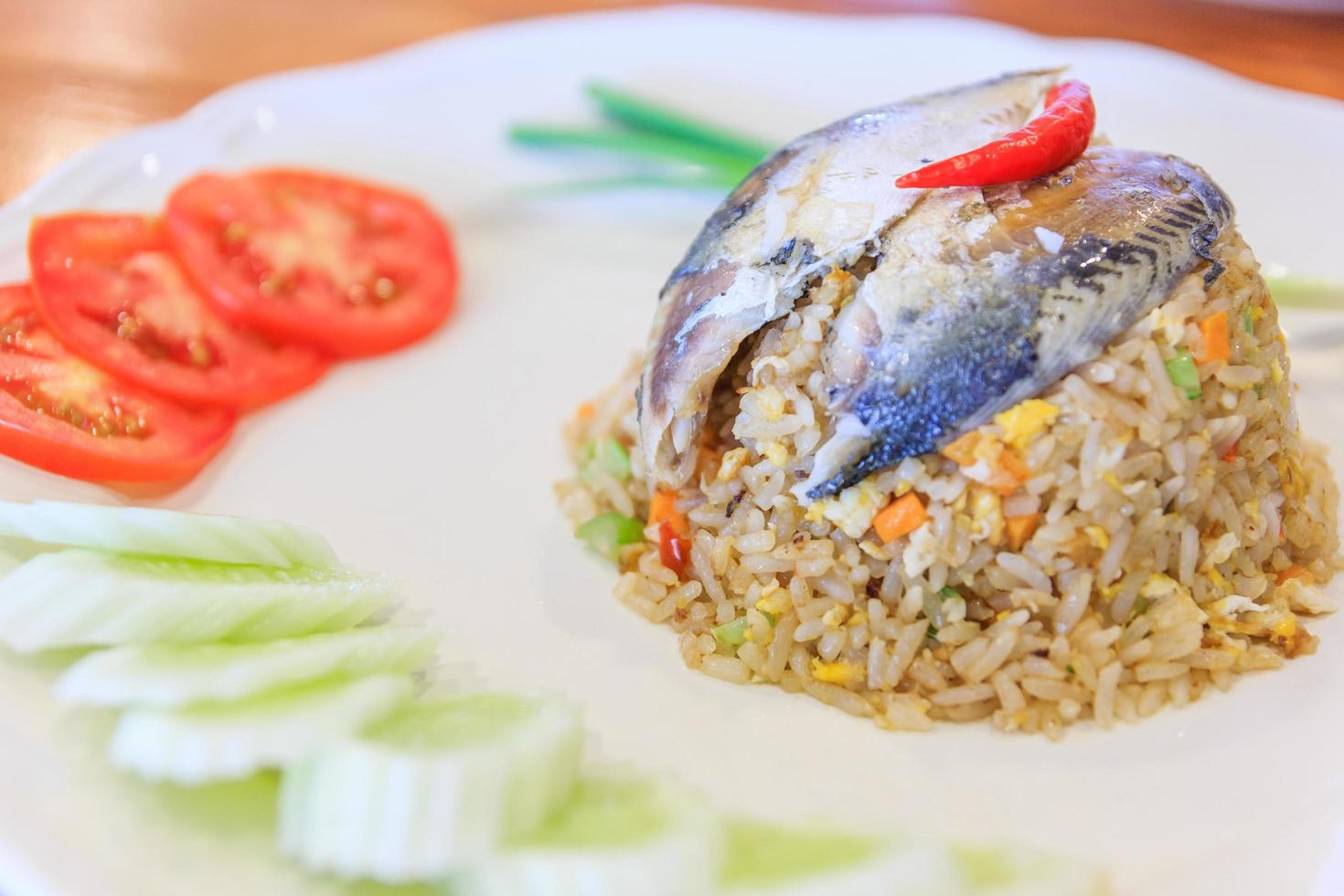 Rice with fried mackerel and vegetable photo