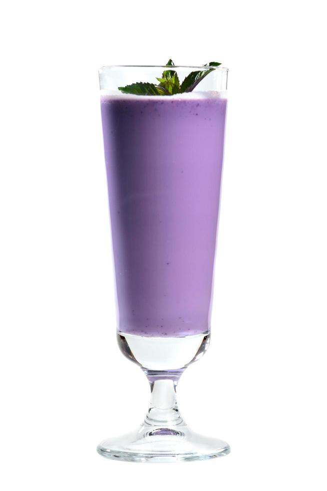 Blueberry milkshake garnished with mint photo