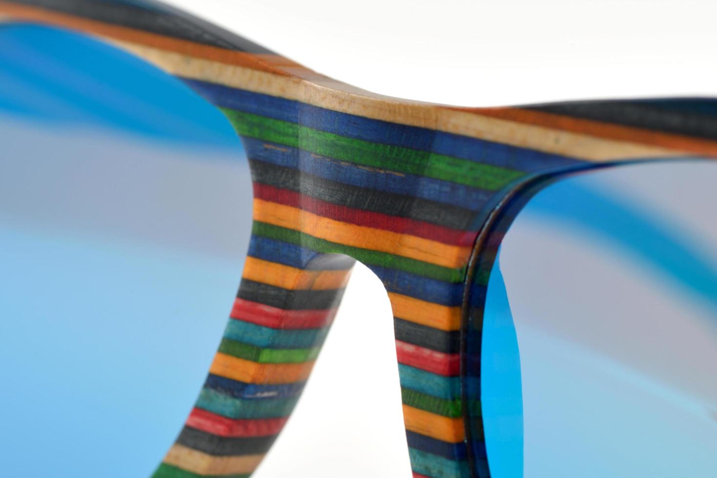 Rainbow-colored wooden sunglasses photo