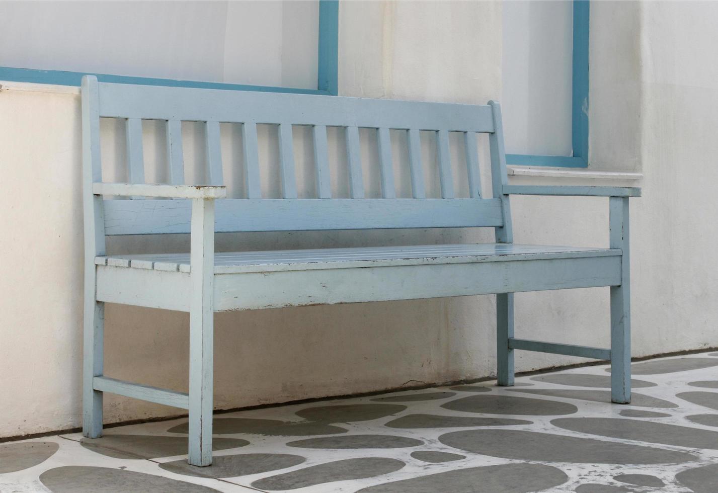 Blue wooden bench outside photo